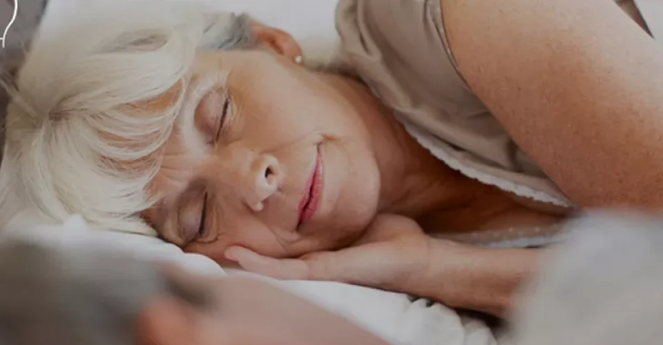 a person lying on a bed