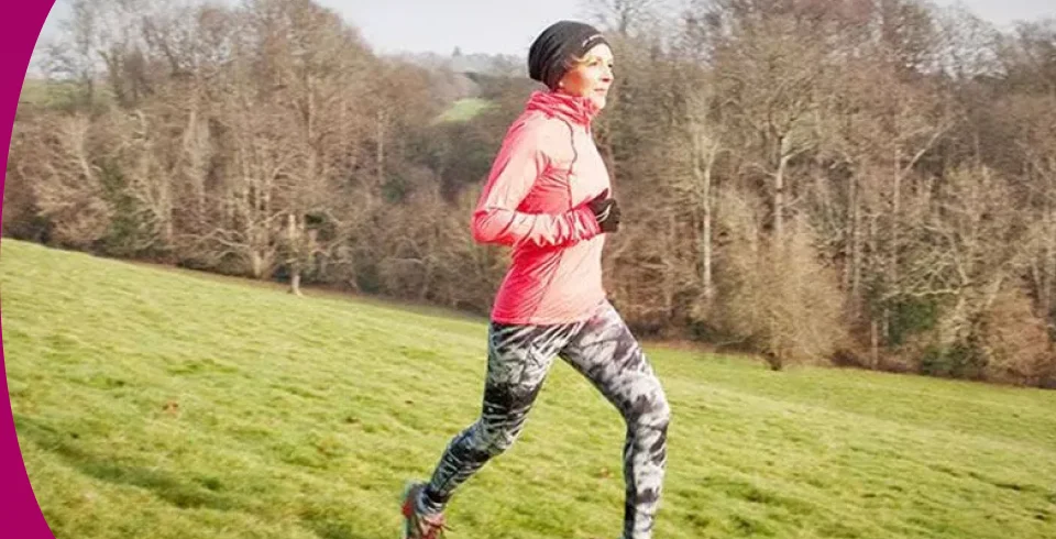 a man running on a grass field